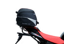 The image of the EVO-12 Bike-Pack Kit reveals three stylish components for the Aprilia Tuono V4 Factory (21 ->): a black pack with red accents, an EVO-Rack metal rack perfect for top-boxes, and versatile L-Brackets with screws. They’re ideal for customizing your adjustable Ventura pack-rack setup.