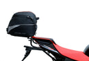 The image of the EVO-12 Bike-Pack Kit reveals three stylish components for the Aprilia Tuono V4 Factory (21 ->): a black pack with red accents, an EVO-Rack metal rack perfect for top-boxes, and versatile L-Brackets with screws. They’re ideal for customizing your adjustable Ventura pack-rack setup.