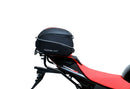 The image of the EVO-12 Bike-Pack Kit reveals three stylish components for the Aprilia Tuono V4 Factory (21 ->): a black pack with red accents, an EVO-Rack metal rack perfect for top-boxes, and versatile L-Brackets with screws. They’re ideal for customizing your adjustable Ventura pack-rack setup.