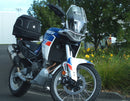 The Ventura EVO-12 Bike-Pack Kit for the Aprilia Tuareg 660 (22 - >) includes a sleek pack, durable Evo-Rack, and L-bracket with screws for easy installation, ensuring secure storage and convenient access on your bike journeys.