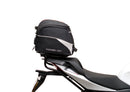 Ventura Aprilia Tuono V4 1100 (21 - >) Bike-Pack Kit shown with labeled images: EVO-12 Pack (soft black bag), EVO-Rack Top-Box Rack (metal bike-mounted rack), and generic L-Bracket plus mounting hardware.