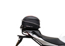 Ventura Aprilia Tuono V4 1100 (21 - >) Bike-Pack Kit shown with labeled images: EVO-12 Pack (soft black bag), EVO-Rack Top-Box Rack (metal bike-mounted rack), and generic L-Bracket plus mounting hardware.