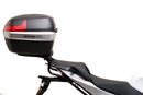 Ventura Aprilia Tuono V4 1100 (21 - >) Bike-Pack Kit shown with labeled images: EVO-12 Pack (soft black bag), EVO-Rack Top-Box Rack (metal bike-mounted rack), and generic L-Bracket plus mounting hardware.