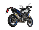 The AKRAPOVIC Slip On Yamaha Tenere 700 is a sleek adventure motorcycle in blue and black, with titanium knobby tires and high exhaust. Shown from a rear three-quarter angle, it highlights its robust build and off-road capabilities, showcasing durability reimagined.
