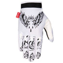 The FIST ANTHONY JEAN FLYING GLOVE is a white motocross glove with black tattoo-style art—an eye with wings and teardrops on the back, detailed finger designs, and a red "FIST" tag by the wrist.