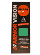 Three green lens protectors are shown beside black and orange Armor Vision packaging labeled “ARMOR VISION SMARTFILM 50MM (PACK OF 3),” featuring a tear-off replacement system and retro-fit lens protector promotion.