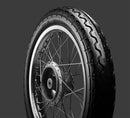A black Avon Vintage and Classic Tire by Avon Tyres with a shiny silver rim shows a classic tread of thin parallel grooves on its circumference, set against a plain white background.