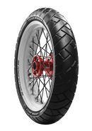 Close-up of a motorcycle wheel against a black background. The tire, an "Avon Trailrider" by Avon Tyres, is black with a white sidewall. It features a white rim, a red hub with black spokes, and has a distinct tread pattern.