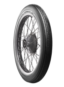 A black Avon Vintage and Classic Tire by Avon Tyres with a shiny silver rim shows a classic tread of thin parallel grooves on its circumference, set against a plain white background.