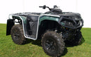 A Ventura Can-Am Outlander Pro XU HD5 (23 - >) with a green and black design is parked on grass. It features rugged tires, a metal frame, handlebars for steering, and bull bars for safety against the clear day's white backdrop.