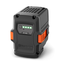 The Husqvarna B140 Battery features a black and orange rugged case, indicator lights with four green bars for full charge status, and supports fast charging—ideal for outdoor power equipment.