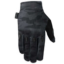 The FIST BLACK CAMO FROSTY COLD WEATHER GLOVE, shown in black and dark gray camouflage with "FIST" in raised letters across the knuckles and a "FIST" tag near the wrist, is ideal for cold weather. Displayed on a white background.