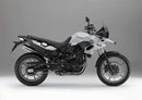 Image showing a Ventura EVO-12 Bike-Pack Kit for BMW F 700 GS (13-15), with three labeled parts: the EVO-12 Pack (black bag), Evo-Rack (metal rack on the motorcycle), and L-Bracket with hardware.