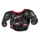 The Alpinestars Bionic Action Kids Chest Guard in black features padded shoulders and chest, with a red lining and a prominent ALPINESTARS logo on the front. Designed for safety and flexibility, this protective gear helps ensure kids' safety during high-intensity sports activities.