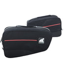 Two black Ventura PANNIER BIKE-PACK KIT bags with red accents and handles are side by side, one slightly in front. These sleek, rectangular motorcycle luggage solutions perfectly fit with Ventura Pannier Frames for an adventurous ride.