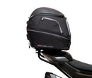 Image shows a Ventura EVO-12 Bike-Pack Kit for CF Moto 800 NK (23->), featuring a black EVO-12 pack, an adjustable metal Pack-Rack on the bike, and a generic L-bracket with mounting hardware.