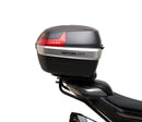 Image shows a Ventura EVO-12 Bike-Pack Kit for CF Moto 800 NK (23->), featuring a black EVO-12 pack, an adjustable metal Pack-Rack on the bike, and a generic L-bracket with mounting hardware.