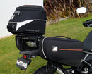Ventura CF Moto 450 MT (24 - >) Bike-Pack Kit includes a black EVO-12 pack, Evo-Rack on the bike, and black L-Bracket with screws—text labels highlight each part, demonstrating the Adjustable Pack-Rack system's versatility.