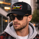 Man wearing a black cap with 'City Honda Racing' logo and sunglasses, standing in an urban setting.