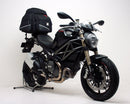 The EVO-12 Bike-Pack Kit image highlights a sleek Ventura bike pack labeled "EVO-12 Pack," including an "Adjustable Pack-Rack" mounted on a Ducati 1100 Monster Diesel (2013) and secured with sturdy black L-Brackets and screws, promising stylish and secure biking adventures.