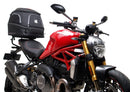 The Ducati 821 Monster (17-21) kit by Ventura showcases a stylish black bike pack with a red stripe and "EVO-12 PACK" label, plus the versatile "EVO-RACK" top-box rack. It includes sturdy L-BRACKET mounts with screws and fittings for secure attachment.