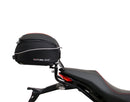 The Ducati 821 Monster (17-21) kit by Ventura showcases a stylish black bike pack with a red stripe and "EVO-12 PACK" label, plus the versatile "EVO-RACK" top-box rack. It includes sturdy L-BRACKET mounts with screws and fittings for secure attachment.