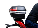 The EVO-12 Bike-Pack Kit for the Ducati 1158 Streetfighter V4/V4S (20 ->) by Ventura includes a black pack with an orange stripe, an adjustable Pack-Rack for seamless bike attachment, and a detailed L-Bracket with screws, all showcased in a generic image.
