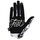 The FIST FLASH GLOVE showcases black and white tattoo-style art with a skull in a hat, swallow, and flowers. "FIST" is printed on the fingers—ideal for standout BMX or MTB riders seeking unique style.