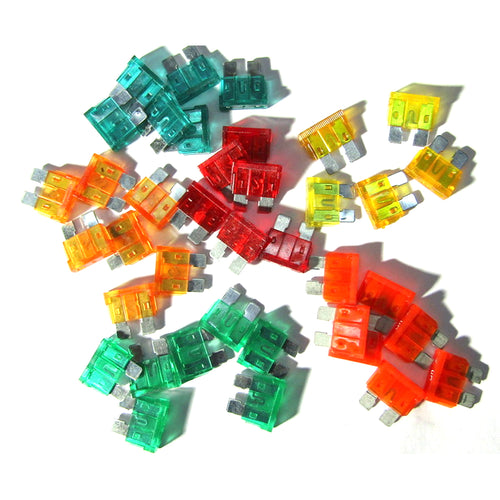 A diverse assortment of colorful automotive fuses from the MISCELLANEOUS STANDARD FUSE 10 AMP 10 PACK, featuring shades of red, orange, yellow, green, and teal. Each fuse is equipped with two metal prongs and a plastic casing, with varying amp sizes labeled by different numbers.