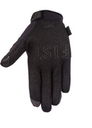 The FIST BLACKOUT GLOVE features a minimal design with "FIST" in raised letters across the knuckles. Shown on a white background, the glove’s palm faces away and the thumb is slightly bent.