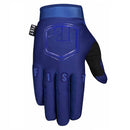 The FIST BLUE STOCKER GLOVE is a single blue motocross glove with black accents, "FIST" lettering across the fingers, a logo on the back of the hand, and a small "FIST" tag on the side, shown palm down.
