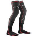The EVS Sports FUSION SOCK / SLEEVE COMBO in Red/Black are long knee brace socks with geometric patterns, branding on the band and lower leg, and targeted support. The design features red and gray accents extending above the knee.