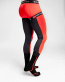 The FUSION SOCK / SLEEVE COMBO | 40TH ANNIVERSARY by EVS Sports is a pair of black and red compression leg sleeves with socks attached, featuring Trac Grip technology. Branding and design details in black appear on the red sections.