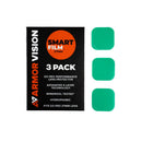 A box labeled "ARMOR VISION SMARTFILM FOR GO PRO 27MM (PACK OF 3)" by Armor Vision sits next to three green rectangular lens protectors, featuring 6-layer tech, hydrophobic coating, and an easy tear-off replacement system.