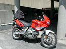 Image of a bike-pack kit showcasing the Ventura EVO-12 Pack, EVO-Rack, and L-Bracket with mounting screws for the Cagiva 900 Gran Canyon (98-00). The sleek black pack pairs perfectly with the robust Top-Box Rack on a bike. L-Bracket shown as a generic image.