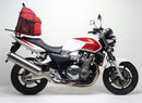 The image showcases the Ventura EVO-12 Bike-Pack Kit, featuring a black pack with orange accents. Featured items include the metal Evo-Rack secured to a Honda CB 1300 S (05-09) and L-Bracket set with screws, all complementing the versatile Top-Box Rack, labeled as a generic image.
