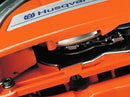 A Husqvarna 3120 XP-32® Chainsaw, perfect for forestry work, is shown with an orange body and a silver blade. The blade has "Husqvarna" printed in blue letters. This chainsaw features a black handle and various control mechanisms, making it ideal for your next outdoor project.