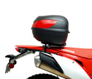 Image displaying components of the EVO-12 Bike-Pack Kit, featuring a black pack with an orange Ventura logo (top left), an EVO-Rack mounted on a bike with pannier support (top right), and a generic L-bracket with screws (bottom). Product for Honda CRF 450 L (2019).