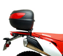 Image displaying components of the EVO-12 Bike-Pack Kit, featuring a black pack with an orange Ventura logo (top left), an EVO-Rack mounted on a bike with pannier support (top right), and a generic L-bracket with screws (bottom). Product for Honda CRF 450 L (2019).