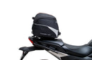 Image of a Ventura EVO-12 Bike-Pack Kit for Honda NC 750X (21 - >), featuring a black pack with orange detail. It includes an adjustable Pack-Rack for secure mounting, the EVO-Rack, and an L-bracket with hardware, all showcased in a generic image.