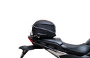 Image of a Ventura EVO-12 Bike-Pack Kit for Honda NC 750X (21 - >), featuring a black pack with orange detail. It includes an adjustable Pack-Rack for secure mounting, the EVO-Rack, and an L-bracket with hardware, all showcased in a generic image.