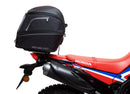 A collage featuring a sophisticated black Honda CRF 300L EVO-12 bike-pack with a bold red stripe, an EVO-RACK for secure mounting, and a standard L-bracket with screws. "Ventura EVO-12 Bike-Pack Kit" is prominently displayed at the top.