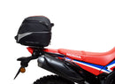 A collage featuring a sophisticated black Honda CRF 300L EVO-12 bike-pack with a bold red stripe, an EVO-RACK for secure mounting, and a standard L-bracket with screws. "Ventura EVO-12 Bike-Pack Kit" is prominently displayed at the top.