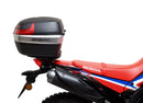 A collage featuring a sophisticated black Honda CRF 300L EVO-12 bike-pack with a bold red stripe, an EVO-RACK for secure mounting, and a standard L-bracket with screws. "Ventura EVO-12 Bike-Pack Kit" is prominently displayed at the top.