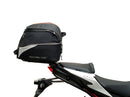 A labeled generic image displays a Honda CB750 Hornet (23 ->) Bike-Pack Kit by Ventura, featuring the versatile Sport-Rack, sleek black EVO-12 Pack with an orange stripe, innovative EVO-Rack for bikes, and handy L-Bracket—shown disassembled with screws.