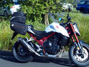 A labeled generic image displays a Honda CB750 Hornet (23 ->) Bike-Pack Kit by Ventura, featuring the versatile Sport-Rack, sleek black EVO-12 Pack with an orange stripe, innovative EVO-Rack for bikes, and handy L-Bracket—shown disassembled with screws.