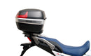 Image displaying the Ventura EVO-12 Bike-Pack Kit for Honda XL 750 Transalp (23->), featuring the EVO-12 pack, Evo-Rack, and an L-bracket with screws. Each labeled component is shown separately against a white background.