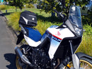 Image displaying the Ventura EVO-12 Bike-Pack Kit for Honda XL 750 Transalp (23->), featuring the EVO-12 pack, Evo-Rack, and an L-bracket with screws. Each labeled component is shown separately against a white background.