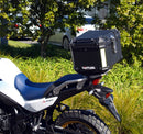 Image displaying the Ventura EVO-12 Bike-Pack Kit for Honda XL 750 Transalp (23->), featuring the EVO-12 pack, Evo-Rack, and an L-bracket with screws. Each labeled component is shown separately against a white background.