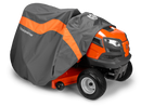 A bright orange riding lawn mower is partially covered by a Husqvarna Tractor Cover, with only the front and wheels visible while the rest is shielded by this heavy-duty cover.